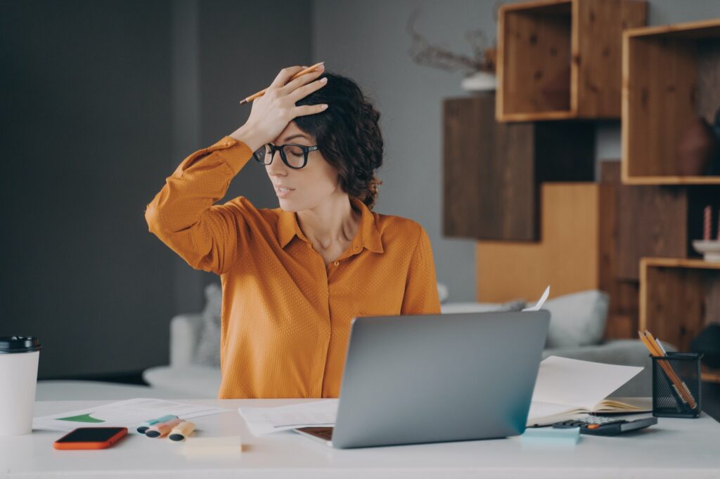 frustrated-italian-female-employee-stressed-about-mistake-or-problem-with-computer-1024x682